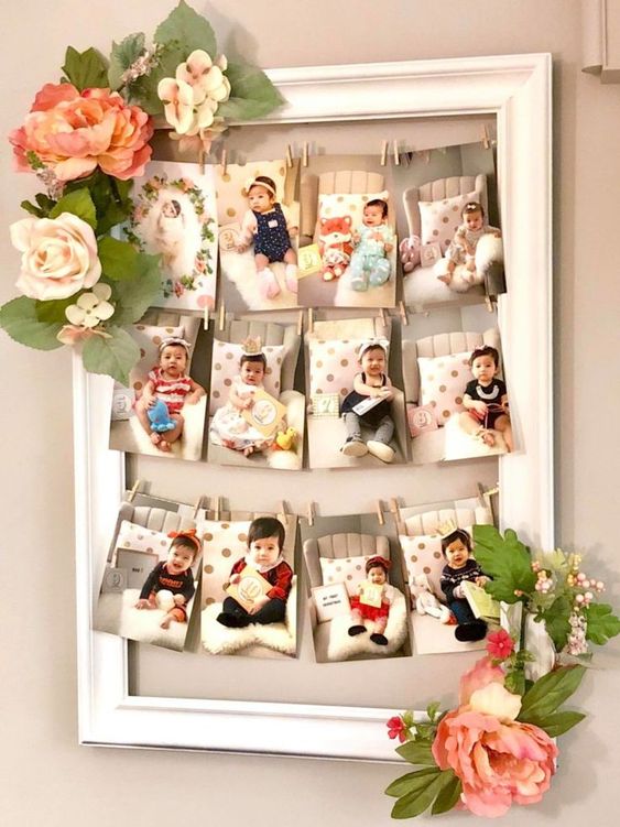 decoração de aniversário com fotos dos meses do bebê em moldura de quadro