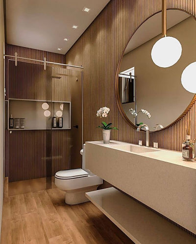 Banheiro com cuba esculpida e espelho redondo