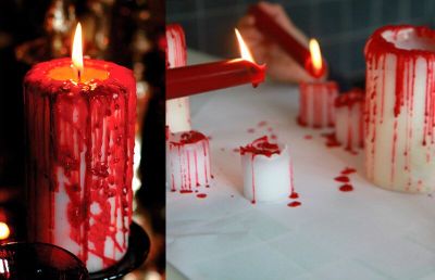 Decoração de halloween com vela branca e vermelha
