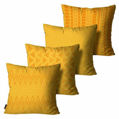 Kit com quatro almofadas com tons de amarelo