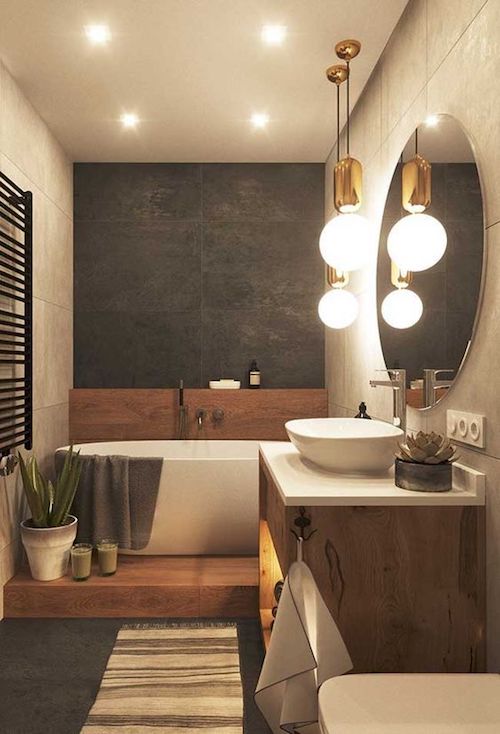 Banheiro com banheira: 5 dicas para decorar em grande estilo! Banheiro com espelho redondo e banheira pequena